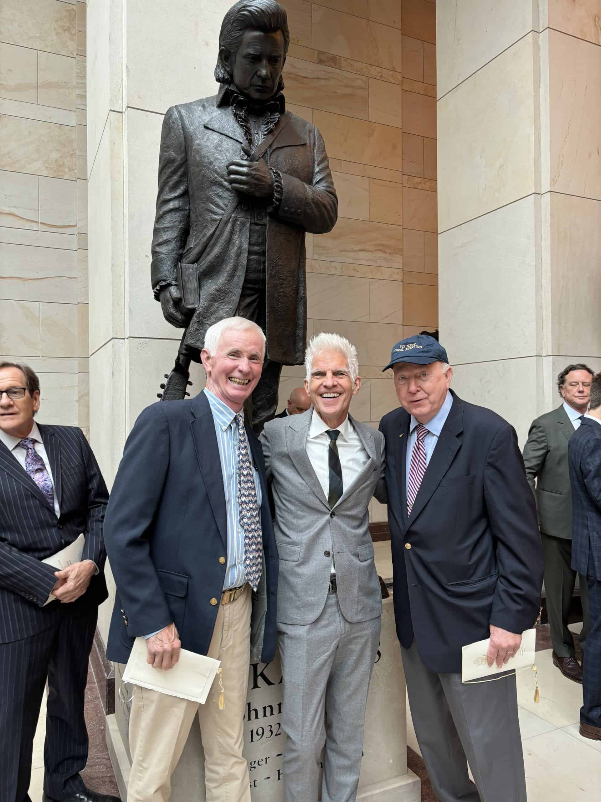From Dyess to DC: The Unveiling of an Enduring Arkansas Icon 4 Carmie with sculptor Kevin Kriese. On the left is Jerry Smith of Commerce MO formerly of Hickory Plains AR scaled