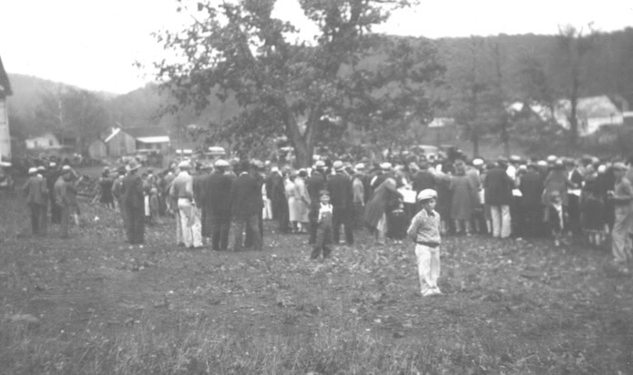 Crowds gather at a church barbecue in Pettigrew